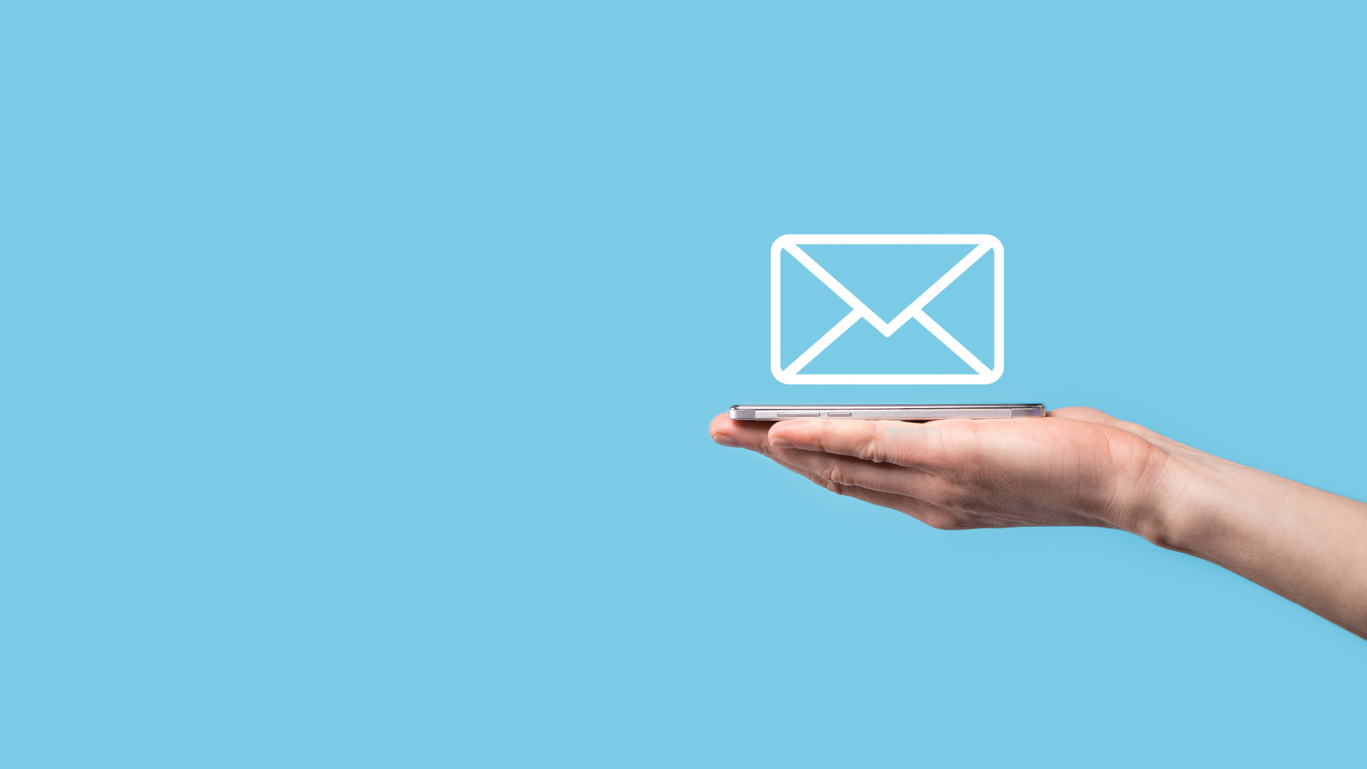 Hand holding an e-newsletter.