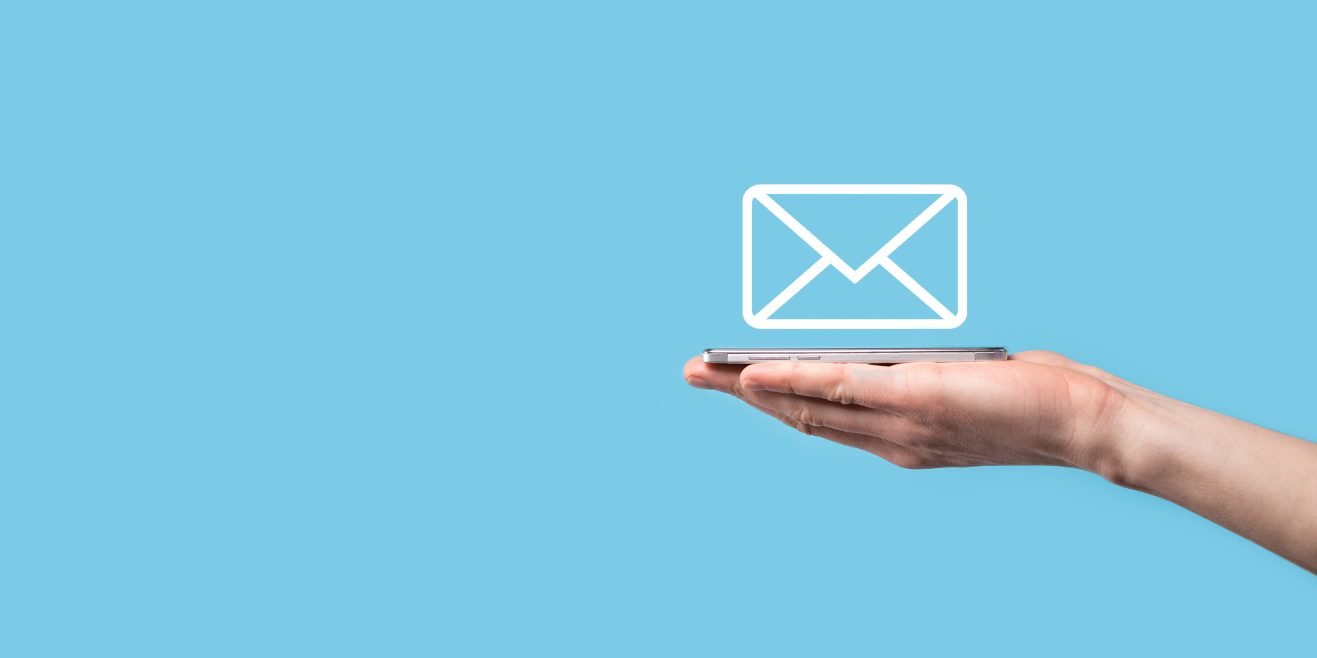Hand holding an e-newsletter.